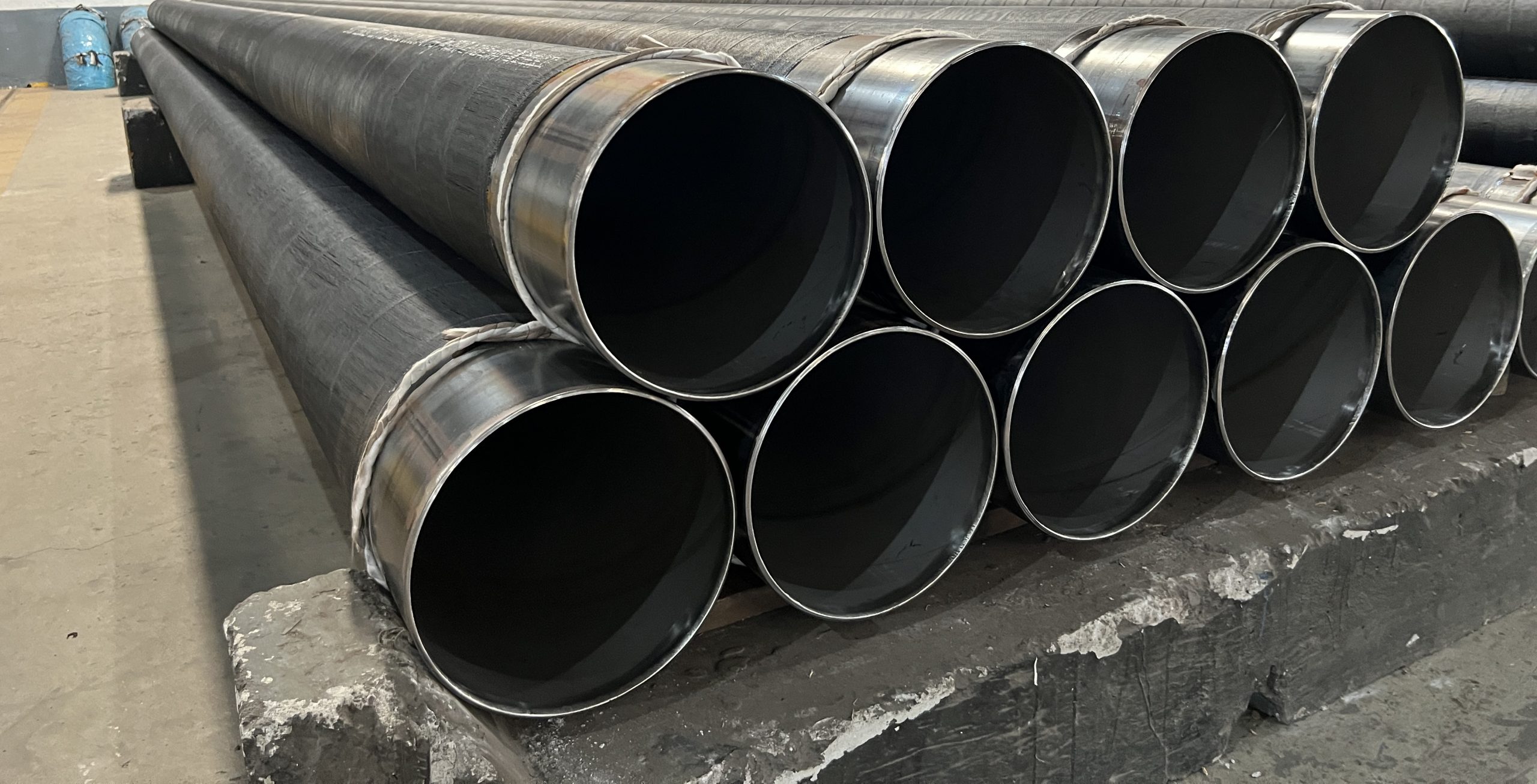CRA clad pipe stock with visible pipe ends