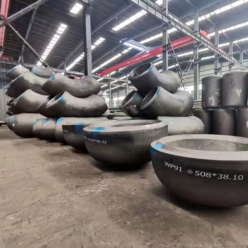 Heavy wall steel pipe fittings in workshop