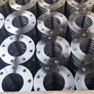 Steel pipe flanges stacked in stock